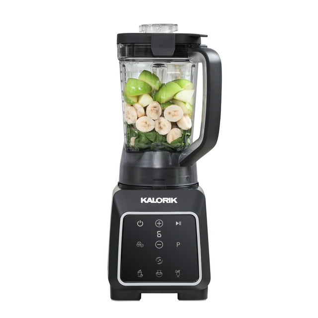 Kalorik 1800 Watt programmable blender in black and silver loaded with fresh banana slices, green apple chunks, and spinach for smoothie preparation.