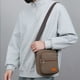 thumbnail image 4 of Bolso Bandolera Impermeable para Hombre - Mochila de Lona con Múltiples Compartimentos y Correa Ajustable para Deportes Al Aire Libre y Uso Diario, 21 X 18 X 6 Cm, 4 of 6