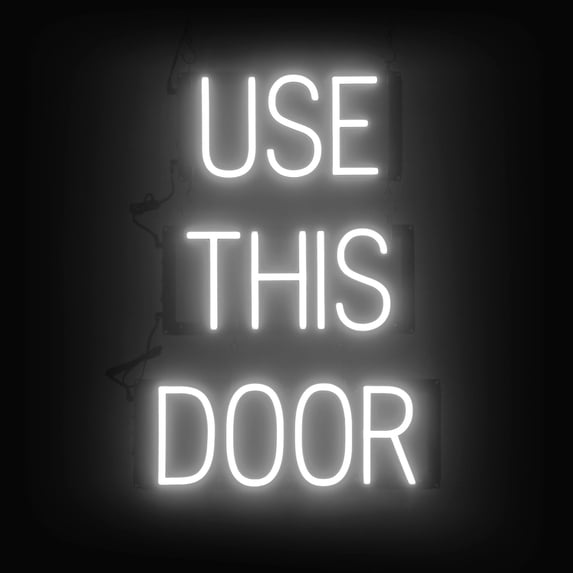 SpellBrite USE THIS DOOR LED Sign for Business. 17.4" x 23.8" White USE THIS DOOR Sign Has Neon Sign Look With Energy Efficient LED Light Source. Visible from 500+ Feet, 8 Animation Settings.