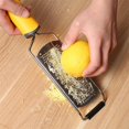 thumbnail image 2 of SURJDE Citrus Zester & Cheese Grater, Lemon Zester with Razor-Sharp Blade & Ergonomic Soft Handle, Shredder for Cheese, Lemon, Ginger, Garlic + Protective Cover + Cleaning Brush, 2 of 4