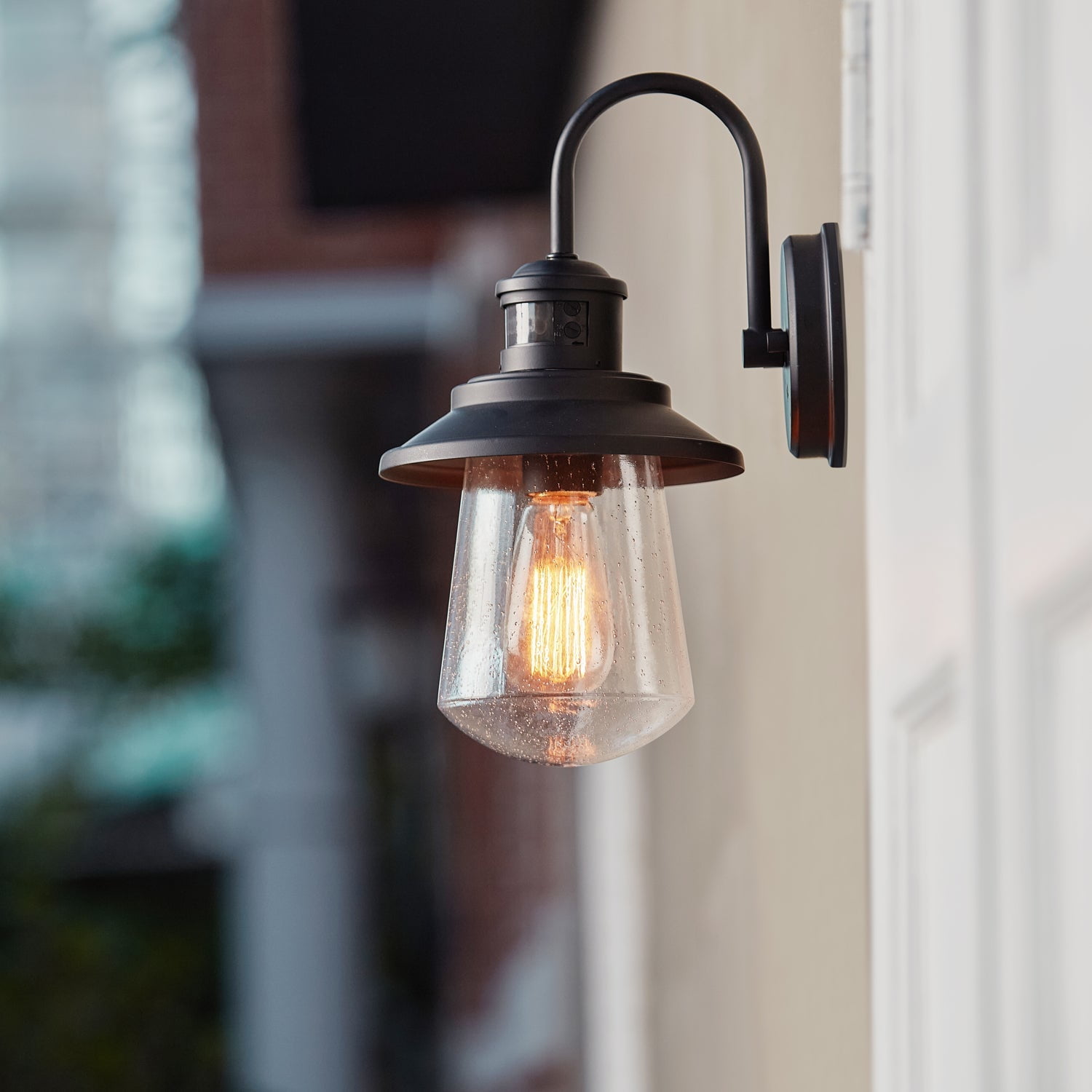 Globe Electric Mariner 1-Light Matte Black Motion Activated Outdoor Wall Sconce with Seeded Glass Shade