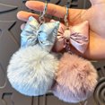 thumbnail image 1 of Llavero De Peluche Llavero con lazo, redondo, ideal para regalo navideño de niña (14 x 7 cm, gris). 1 unidad. JASKFLY, 1 of 8