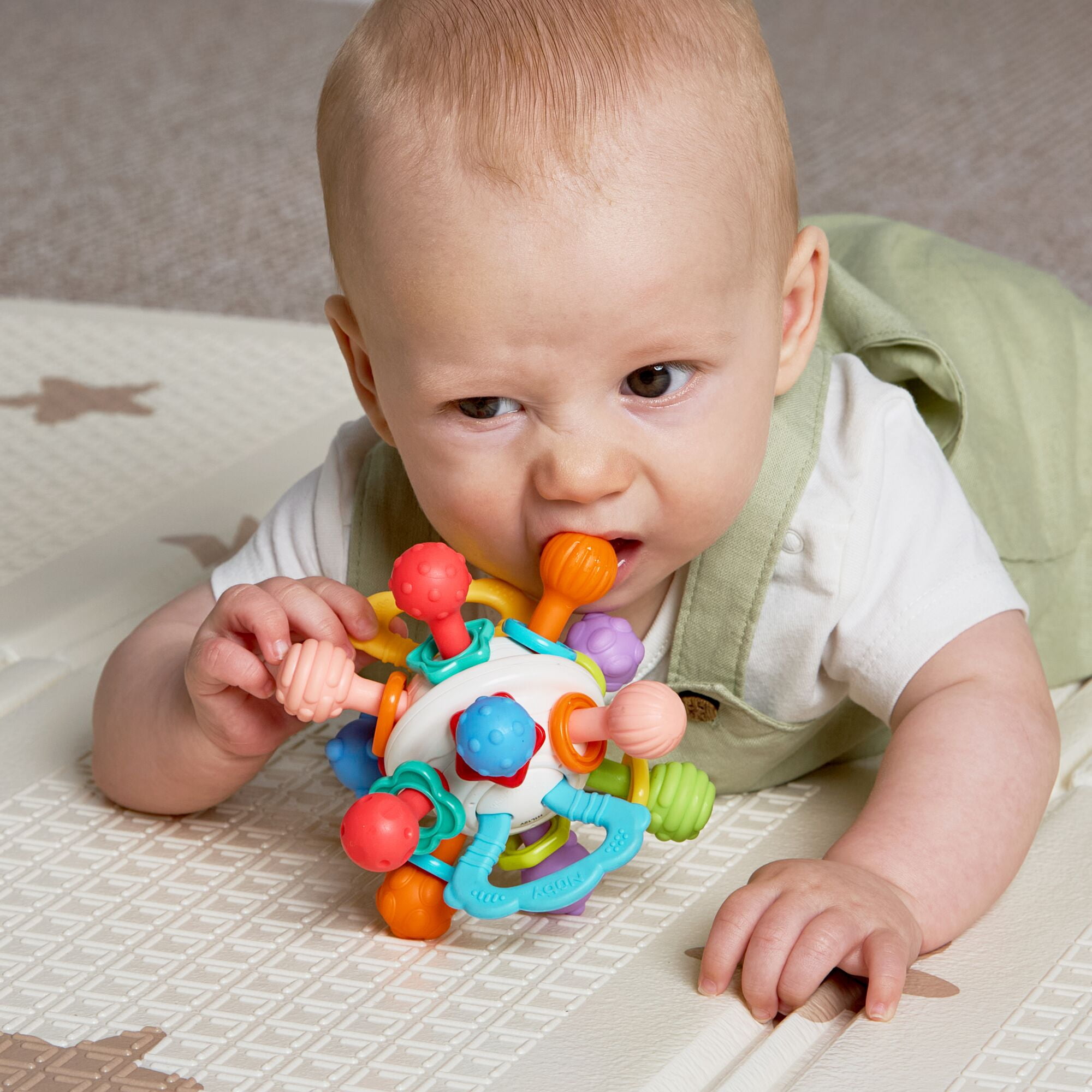 Nuby Textured Twist Ball Baby Teether Infant Toy with Colorful Rattle
