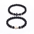 thumbnail image 1 of Set de pulseras con forma de cruz de obsidiana para parejas, hechas a mano con piedra mate, 1 of 2