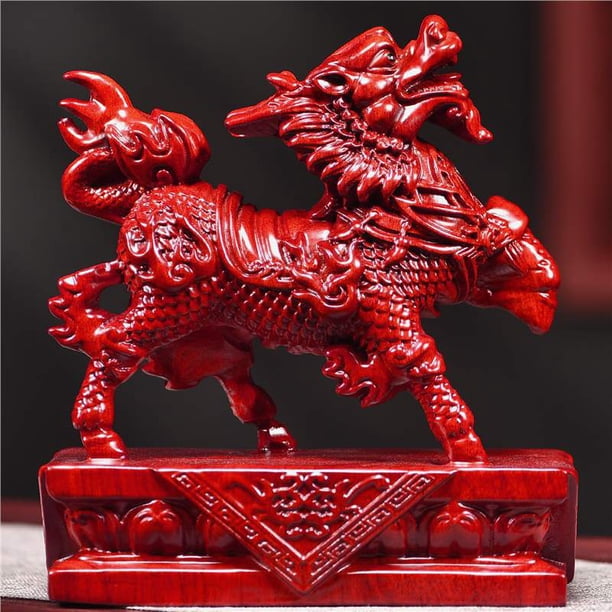 A pair of red solid wood carved Qilin figurines, auspicious water and fire feng shui decorative crafts for home living room and office.