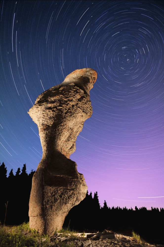Light painting on monolith and star trails Anse des Bonnes Femmes at Ile Niapiskau Mingan Archipelago National Park Reserve of Canada Cote-Nord Duplessis region Quebec Canada Canvas Art - Yves Marcoux
