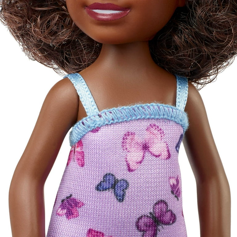 doll with brown curly hair and brown eyes