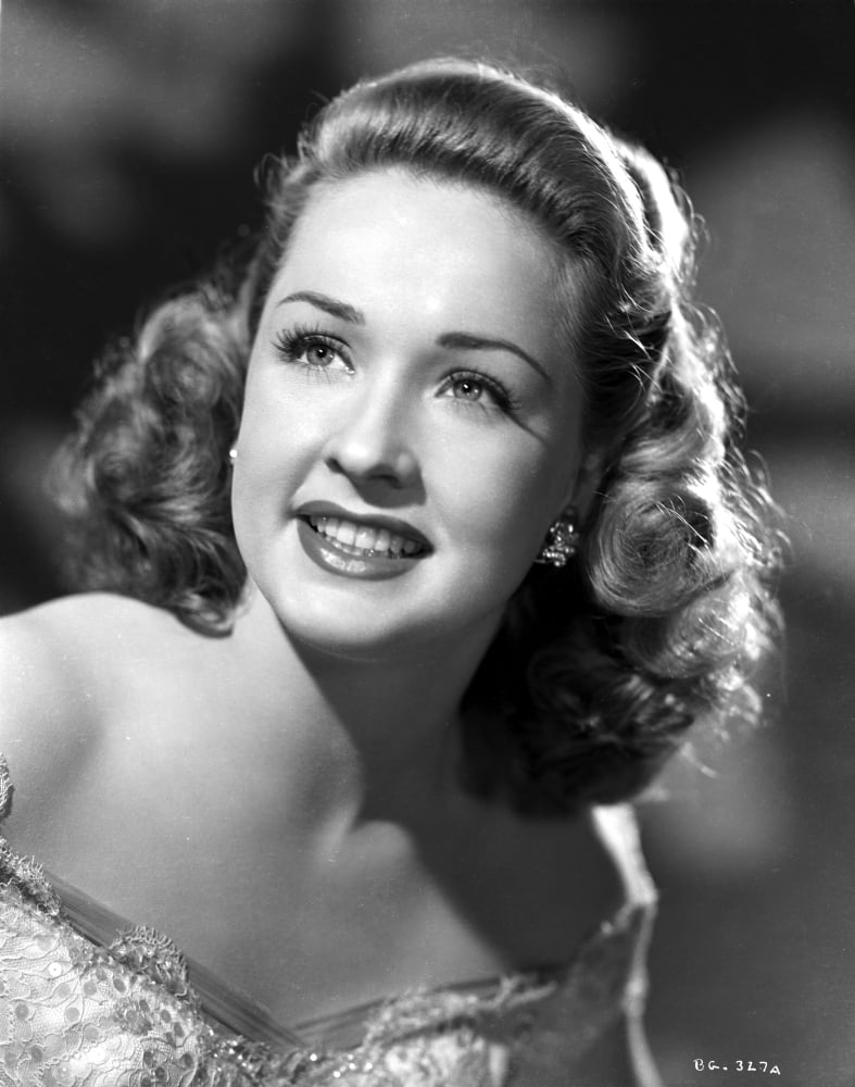 Bonita Granville smiling and Looking Up wearing Lace Dress in Gray ...
