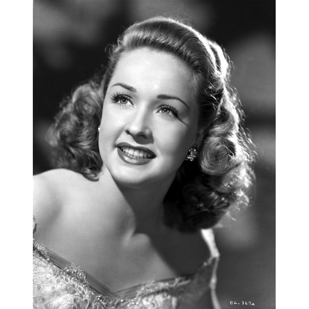 Bonita Granville smiling and Looking Up wearing Lace Dress in Gray