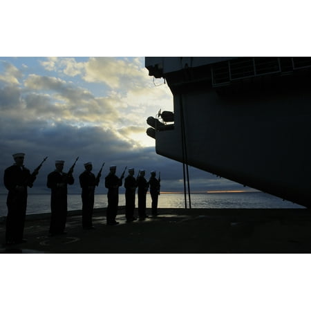 Aircraft To Arm LAMINATED POSTER Sailors assigned to the aircraft carrier USS Dwight D. Eisenhower (CVN 69) present arms during a su Poster Print 24 x 36 ()