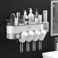 thumbnail image 2 of Juego de accesorios de baño, soporte magnético para cepillo de dientes con taza, dispensador de pasta de dientes, estante de almacenamiento de artículos de tocador, exprimidor de pasta de dientes, 2 of 4