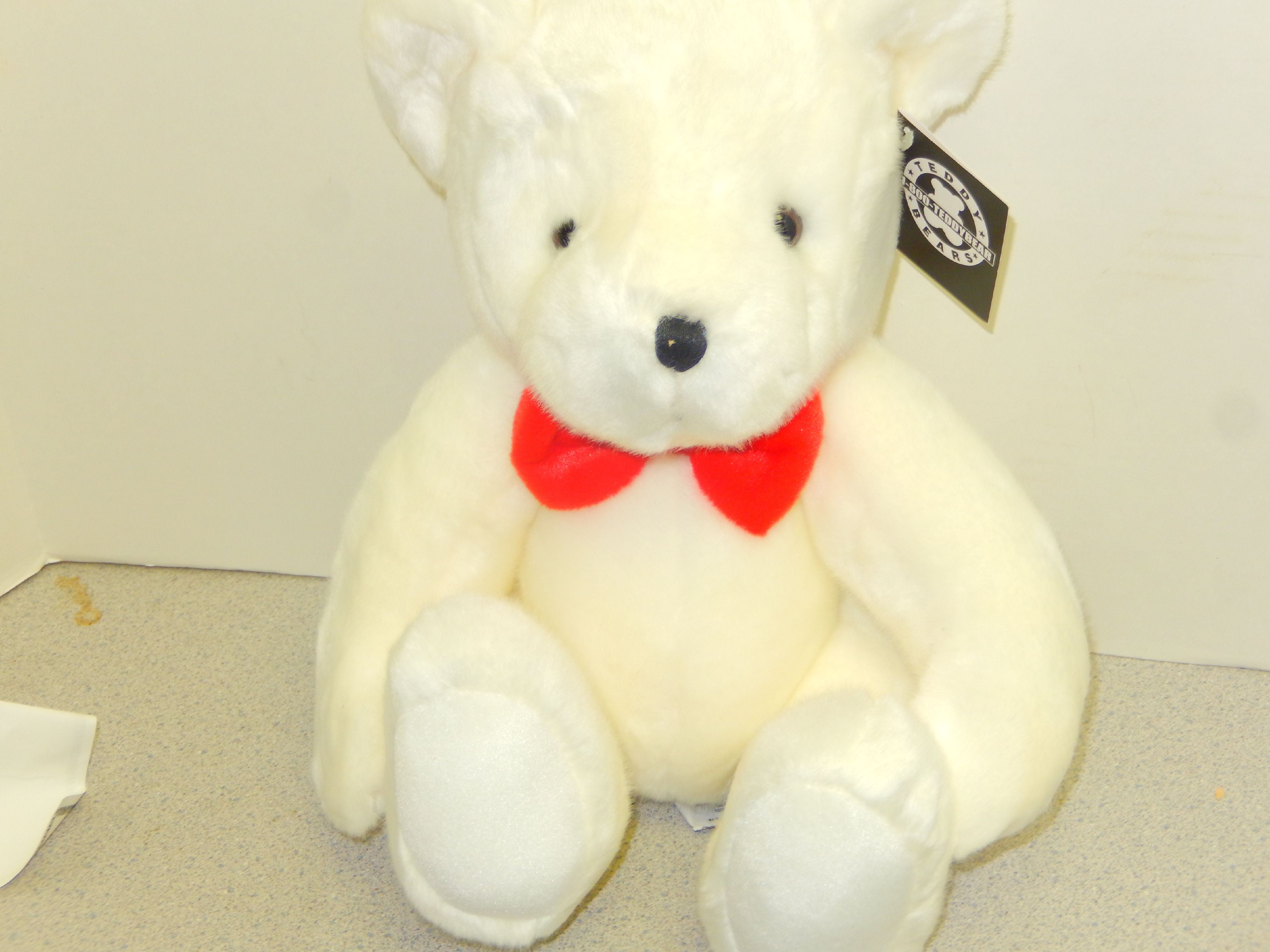 white teddy bear with red bow