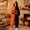 Brown, variant on Women's Oversized Onesies Pajamas - Cozy Pumpkin Halloween Costumes,Soft Plush Hooded Jumpsuit with Jack-O-Lantern Hood and Side Pockets for Homewear Sleepwear Saffron M