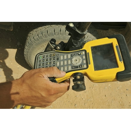 - US Air Force technician using a global positioning system device Poster Print