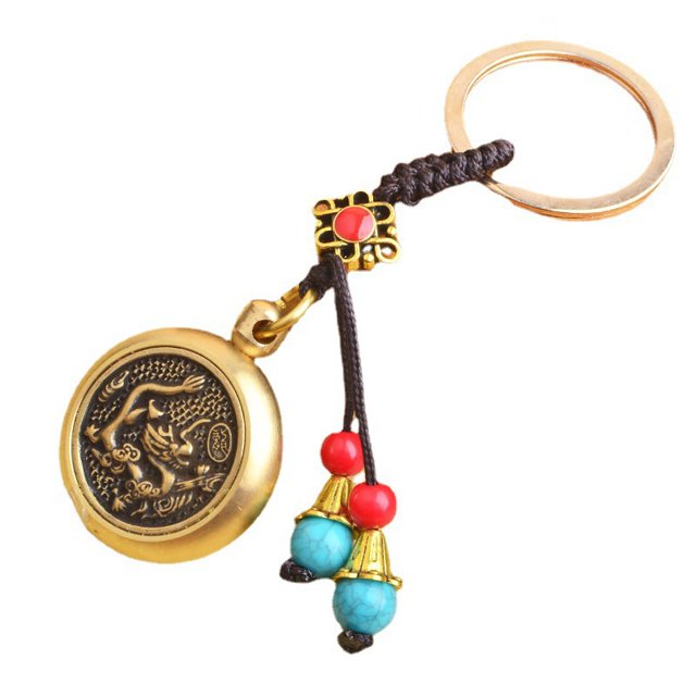 Llavero vintage con diseño de dragón de latón con moneda giratoria del zodíaco