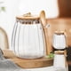 thumbnail image 1 of Tarro de vidrio para almacenar té con cuchara | Recipiente de cristal hermético para hojas de té, hierbas, especias | Diseño transparente duradero | Limpieza fácil | Organización moderna de cocinas, 1 of 5