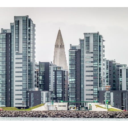 Modern apartment buildings surrounding Hallgrimskirkja Church Reykjavik Iceland Canvas Art - Panoramic Images (24 x