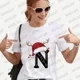 thumbnail image 1 of Camiseta navideña a juego para la familia, ropa de mujer a la moda, 26 letras del alfabeto, camisetas gráficas estampadas, ropa de calle, camisetas de manga corta, 1 of 5