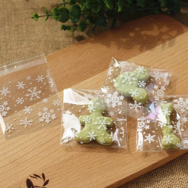 MELLIEX 100pcs Navidad Bolsas De Celofan, Bolsas De Copo De Nieve Para Chuches Galletas Bolsa De Dulces Navideños Con 100 Lazos Retorcidos(27x13cm Y 20x10cm