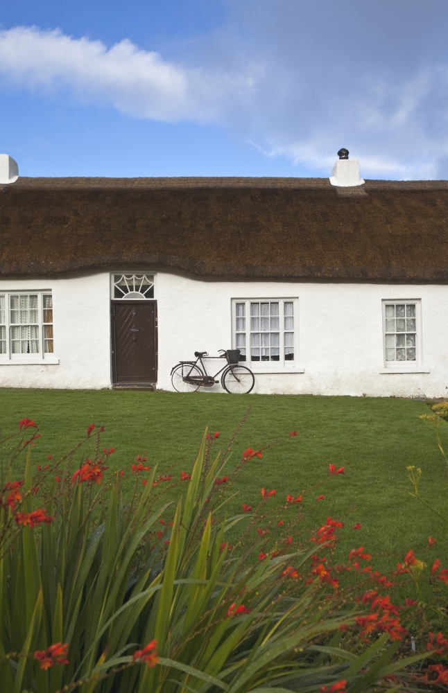 Hezletts picturesque thatched cottage dating from 1690 - one of the oldest vernacular domestic buildings in Northern Ireland Castlerock near Coleraine County Derry Northern Ireland Canvas Art - Pan
