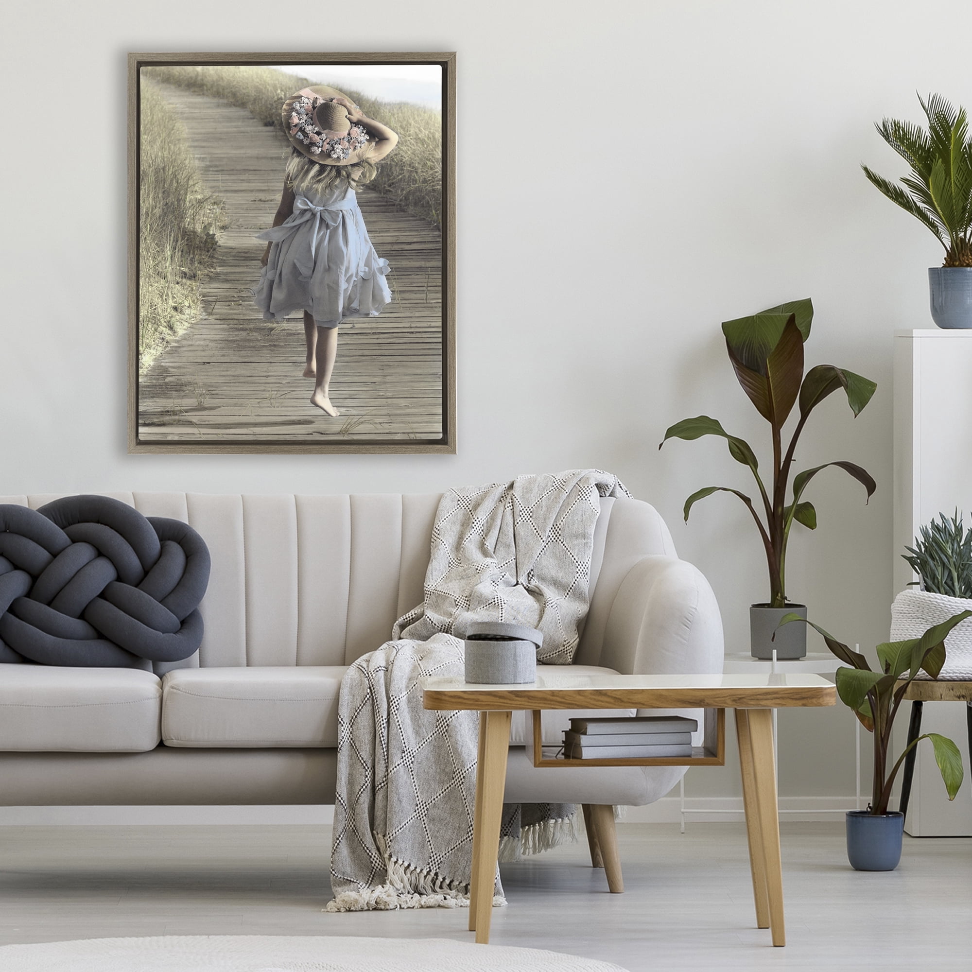 Stupell Industries Girl With Sun Hat Walking Brown Framed Floater Canvas Wall Art, design by Kendra Dew