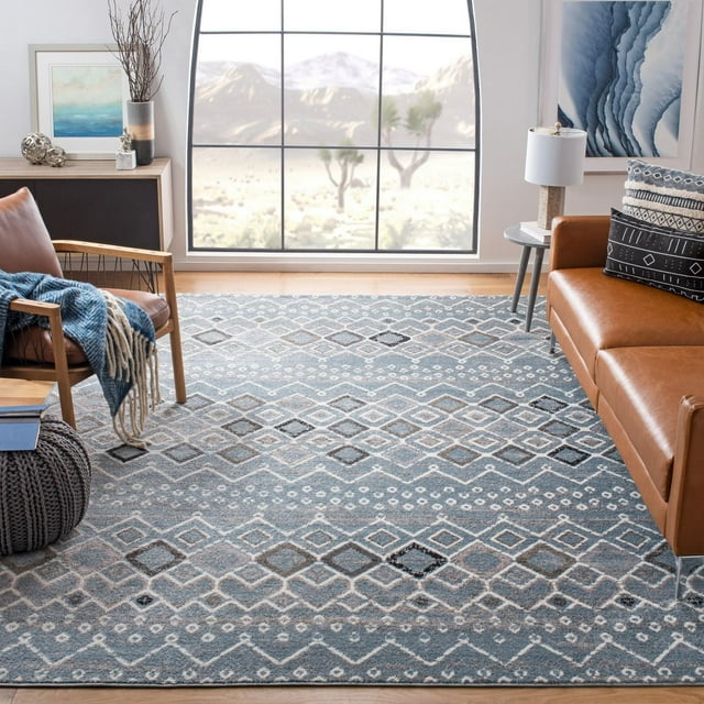 SAFAVIEH Amsterdam Gladwin blue and gray geometric area rug displayed in a contemporary living room setting with leather furniture.