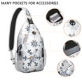 thumbnail image 2 of Sling Backpack,Blue Christmas Snowflake Pattern Sling Bag with Water Bottle Holder,Waterproof Sling Bag for Men/Women with Headphone Jack for Hiking,Travel, 2 of 6