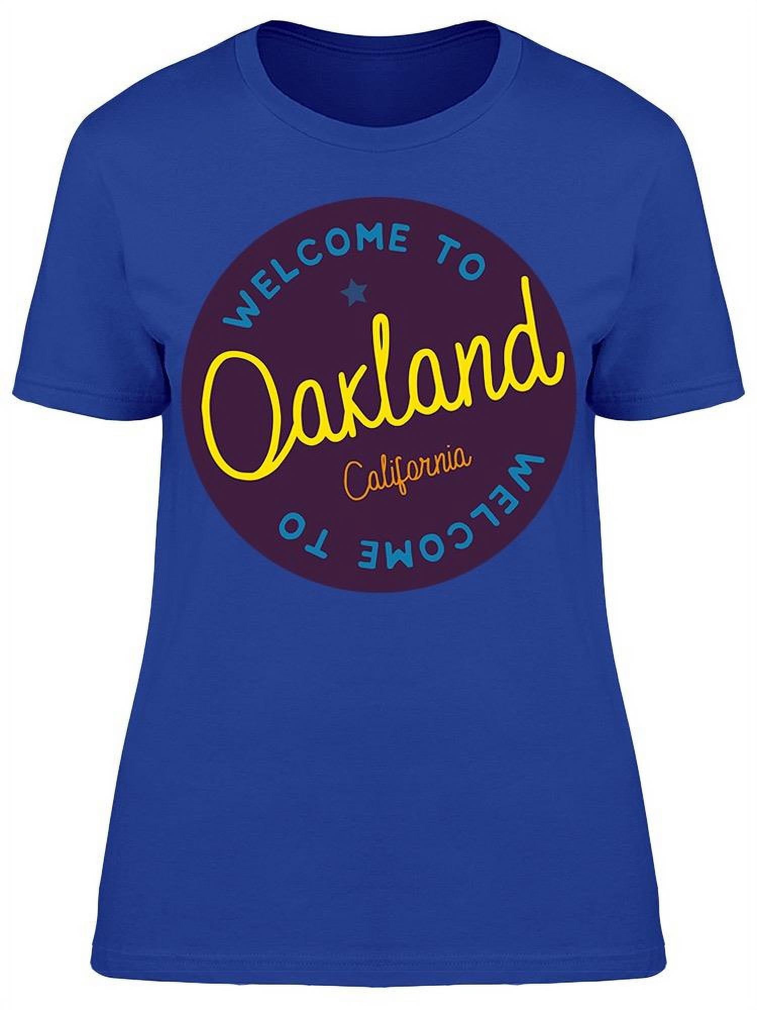 OAKLAND, United States - Women show a T-shirt with the image of