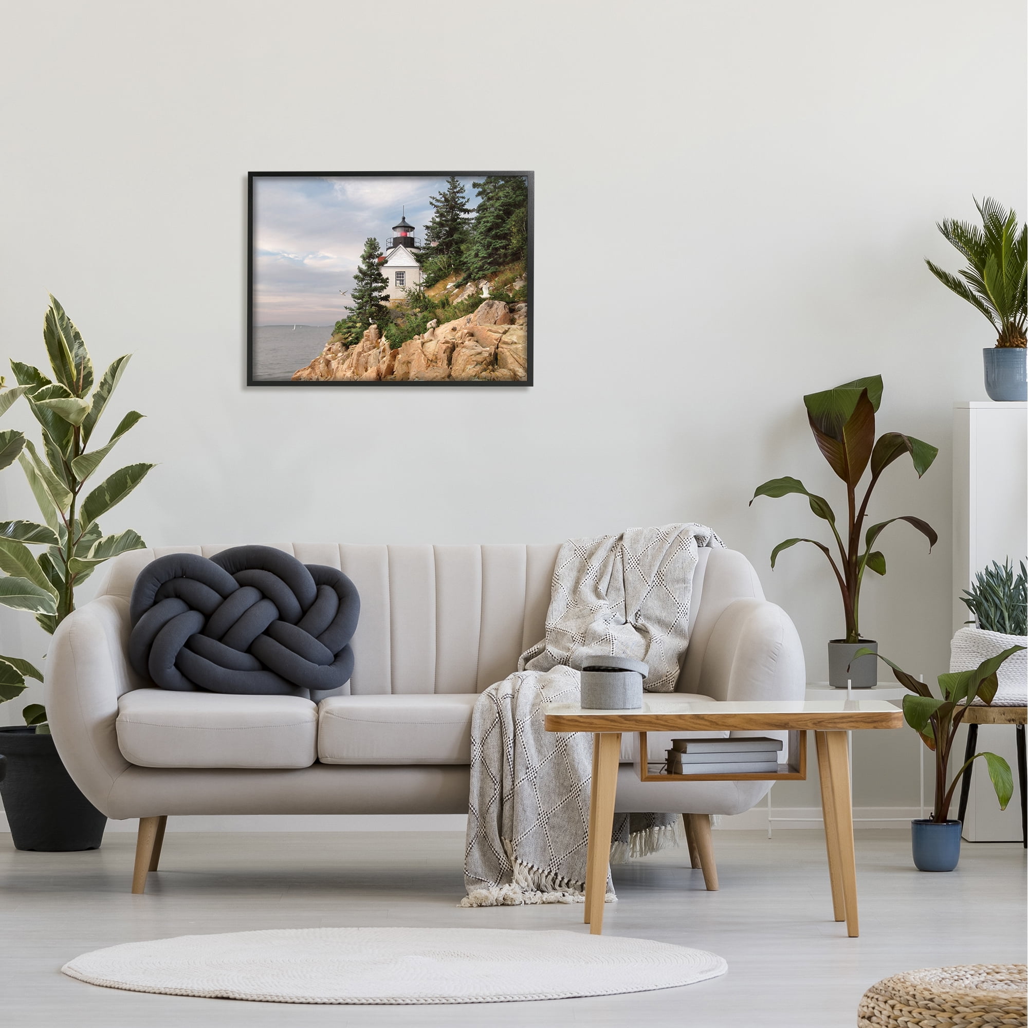 The Stupell Home Decor Collection Harbor Lighthouse Seaside Photograph with Fir Trees and Rocky Cliff Framed Giclee Texturized Art
