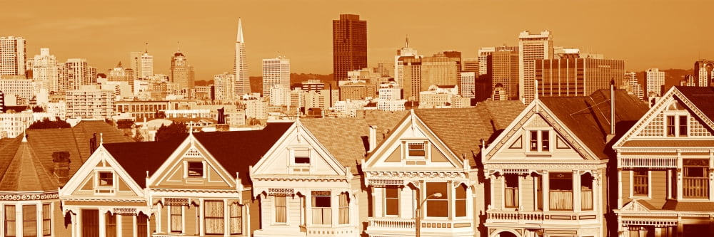 These are the historic Victorian homes in front of the skyline on Steiner Street in sepiatone They are painted pastel colors and line up next to each other in row house formation Canvas Art - Panorami