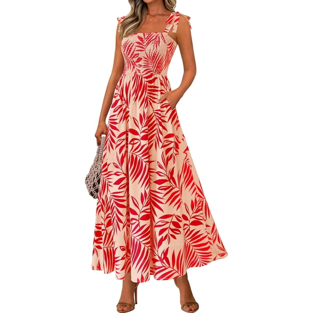 vestido de verano prettygarden floral sin mangas maxi rojo s vestido maxi rojo con estampado floral blanco y rojo, vista frontal a tres cuartos; tirantes de lazo ajustables, corpiño fruncido elástico, falda acampanada de gasa con bolsillos laterales visibles y largo hasta el tobillo; modelo con bolso tejido y sandalias, adecuado como vestido bohemio de vacaciones y a menudo usado también para sesiones de fotos de maternidad.