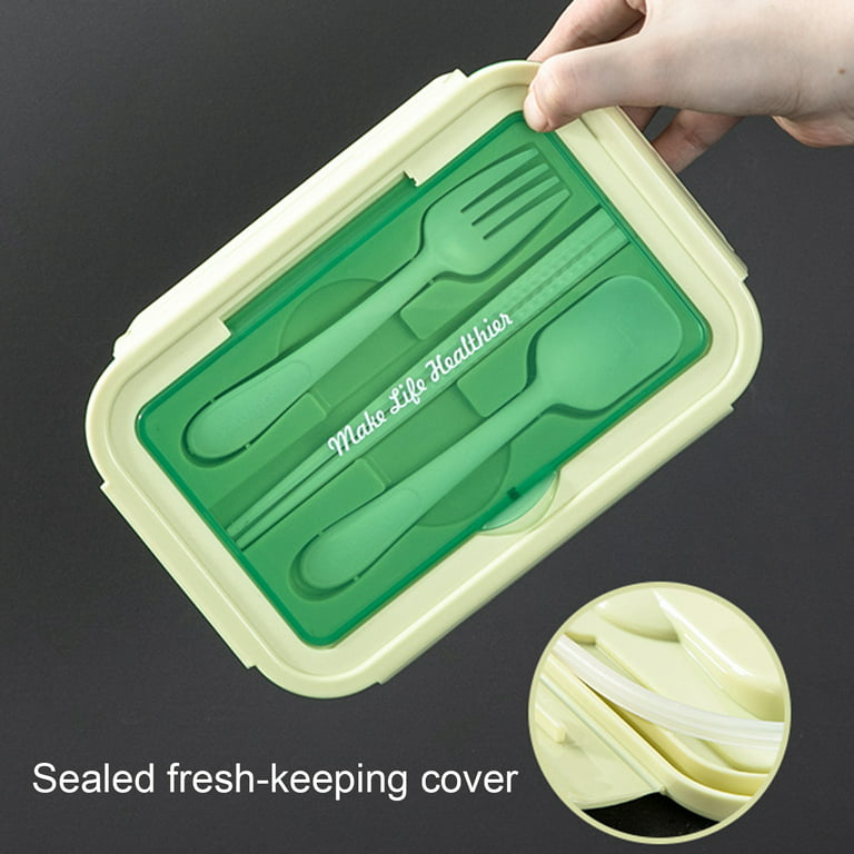 Premium Photo  Green plastic lunch box with fork, spoon, knife on