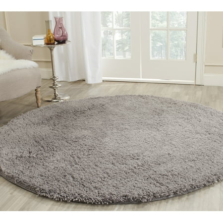 Safavieh SAFAVIEH Classic Shag SG240G Handmade Grey Rug SAFAVIEH Classic Shag SG240G Handmade Grey Rug With a hint of high fashion this plush shag area rug encourages your bare feet to stroll through luxury. These contemporary rugs have been hand-tufted using uber-soft synthetic yarns for a timeless aesthetic. Rug has an approximate thickness of 1.75 inches. For over 100 years  SAFAVIEH has set the standard for finely crafted rugs and home furnishings. From coveted fresh and trendy designs to timeless heirloom-quality pieces  expressing your unique personal style has never been easier. Begin your rug  furniture  lighting  outdoor  and home decor search and discover over 100 000 SAFAVIEH products today.