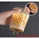 thumbnail image 2 of Glass Coffee Canister Airtight Storage Jar Petal Decorative Container with Bamboo Lid Metal Handle Easy to Grasp (small conical), 2 of 4
