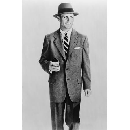 Male Model Dressed In A Wearing Single-Breasted Grey Flannel Suit And Hat Representing A Businessman 1953