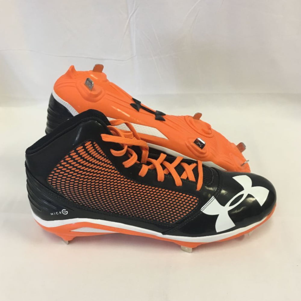 orange and black under armour baseball cleats