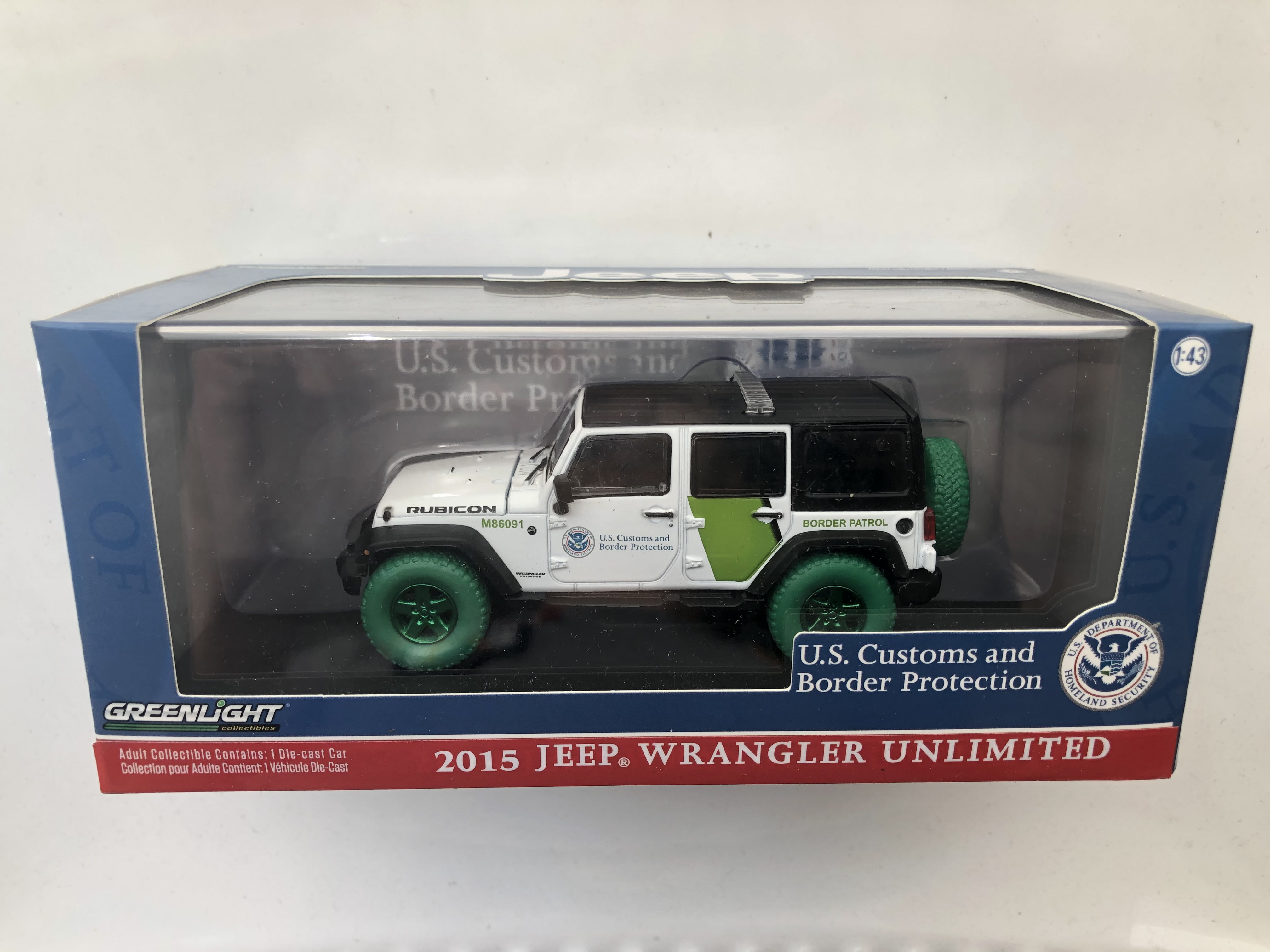 GREENLIGHT 1:43 . CUSTOMS & BODER PROTECTION 2015 JEEP WRANGLER  UNLIMITED GREEN MACHINE CHASE 86091 