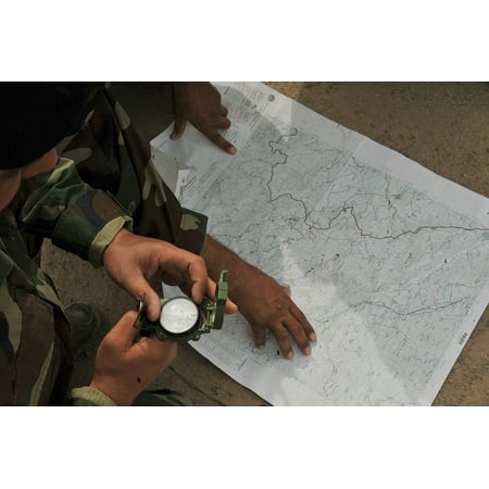 LAMINATED POSTER Iraqi air force airmen use a map and compass during the land navigation portion of their BMT Top Off Poster Print 24 x