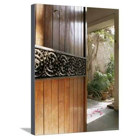 Decorating Ideas For Front Door A Modern Front Door Decorated with a 400 Year Old Piece of Wood Carving Stretched Canvas Print Wall Art By John Henry Claude Wilson ()