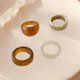 thumbnail image 3 of Conjunto De Anillos De Resina De Colores Ajustable Chica 4 piezas marrón beige. Hugo Anillos abiertos, 3 of 7