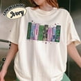 thumbnail image 2 of Wicked Book Shelf Tee | Light Green Vintage Graphic Shirt | Broadway-Inspired Pastel Book Stack Top, 2 of 4