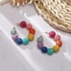 thumbnail image 4 of BR Pendientes de aro con bola de rafia Bohemia Beach: ligeros y elegantes, 4 of 5