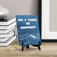 thumbnail image 3 of Signs ByLITA Use A Towel On Equipment Table Sign with Acrylic Stand (6x8“) Inspirational | Gym | Energize Your Space | Premium Sublimated Hardboard | Easy to Read | Includes Easel Stand, 3 of 4