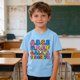 thumbnail image 1 of Blusas y camisas de manga corta con cuello redondo para niños y niñas, camisetas gráficas de manga corta, blusas con estampados bonitos para la temporada escolar., 1 of 9