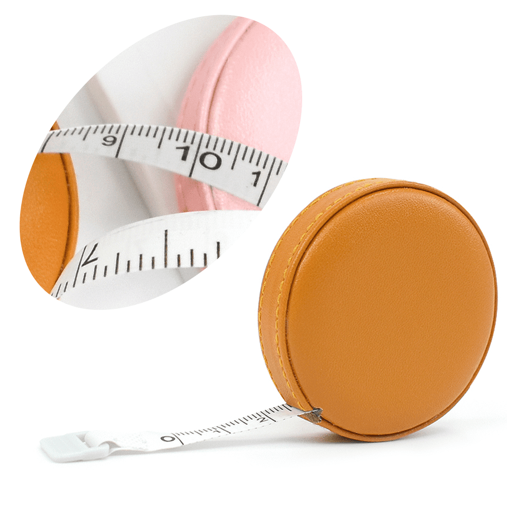 Top view of yellow soft measuring tape. Minimalist flat lay image of tape  measure with metric scale over turquoise blue background. Panoramic  orientation photo of tape measure with copy space. Stock Photo