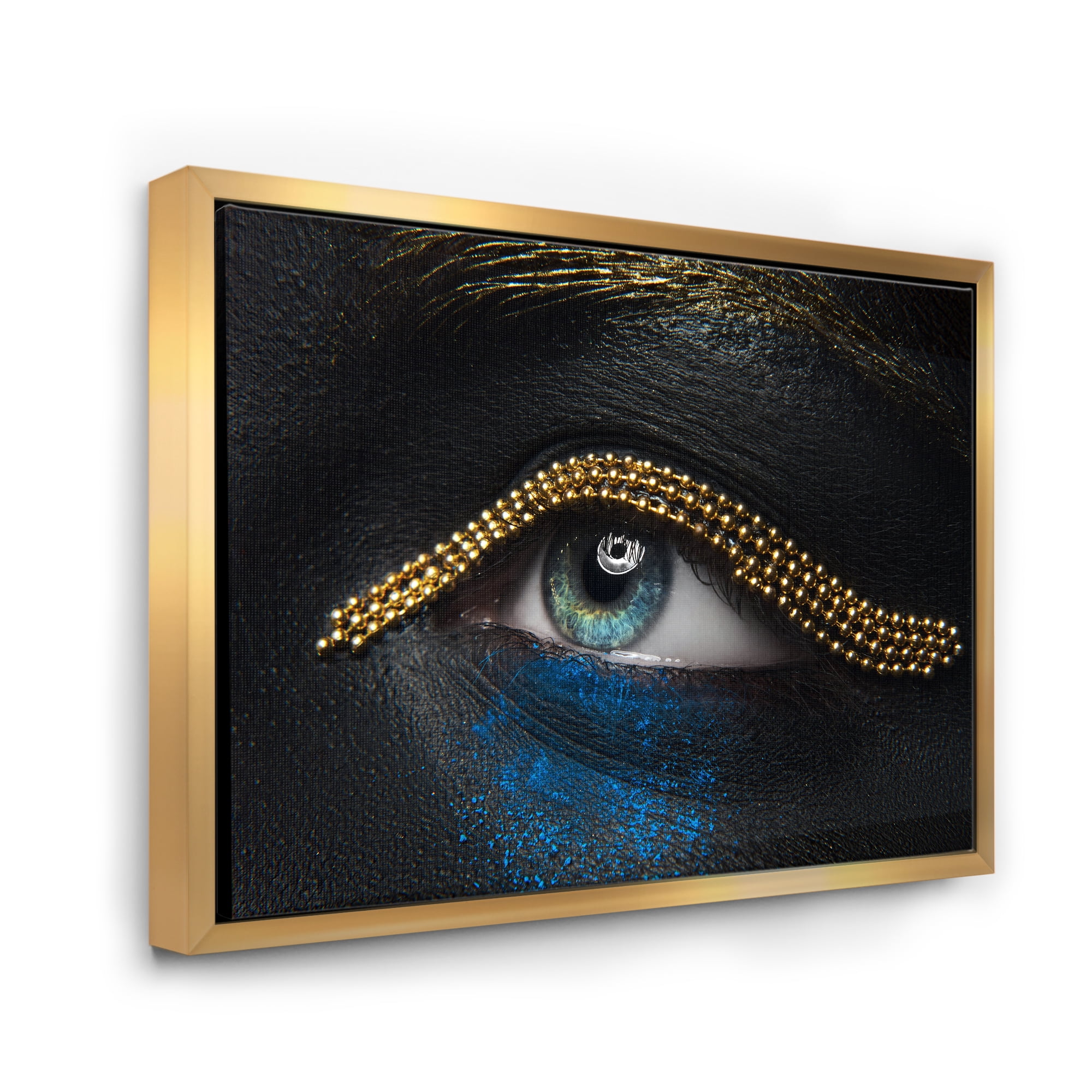 Woman Eyes With Black Skin With A Gold Chain 32 in x 24 in Framed Photography Canvas Art Print, by Designart