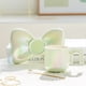 thumbnail image 4 of Tazas de café de cerámica, tazas creativas y lindas con platillos con forma de lazo, novedosas tazas de café con agarre cómodo para oficinas y familias, 6,5 onzas para té con leche y leche., 4 of 5