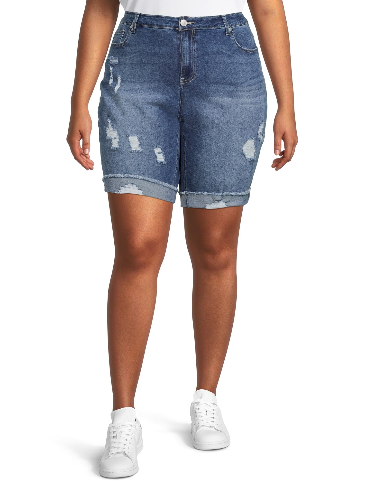 model wearing denim bermuda shorts