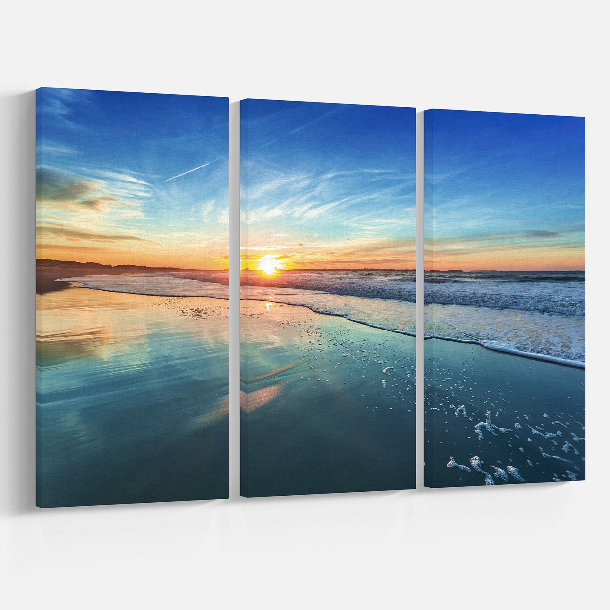 Design Art Blue Seashore with Distant Sunset Seashore Canvas Wall Art