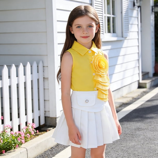 Conjunto de falda y top de moda sin mangas con falda plisada para niña en primavera.